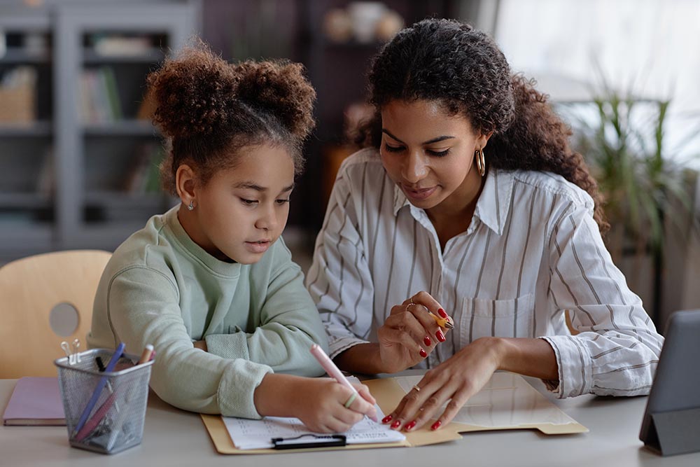 mom helping child convert a mixed fraction to an improper fraction